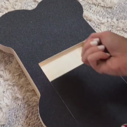Dog using the nail scratch board